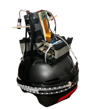 SafeRider smart helmet prototype with onboard camera, laser turn-signal module, and embedded electronics